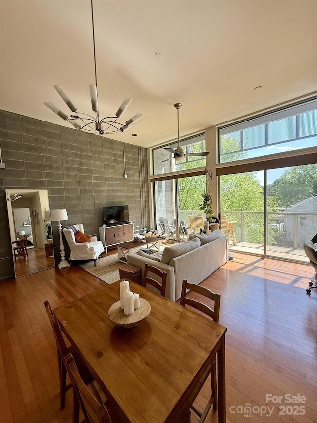 2116 Mcclintock Rd Unit 123, Charlotte, NC 28205 - dining area featuring expansive windows and hardwood / wood-style floors