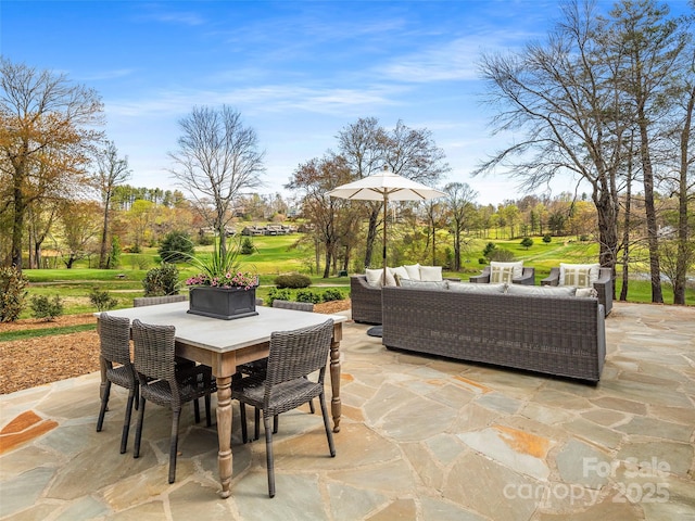 view of patio with outdoor dining area, golf course view, and an outdoor hangout area