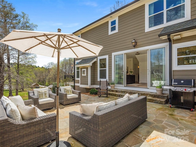 view of patio with an outdoor living space and grilling area
