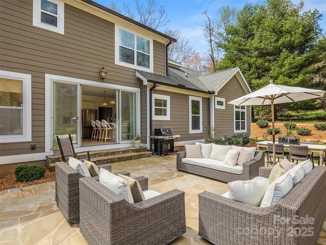 view of patio with grilling area and an outdoor hangout area