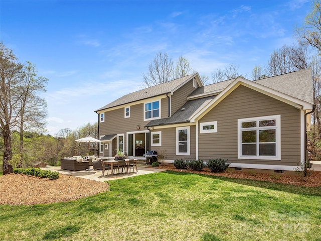 rear view of property with a lawn, a shingled roof, an outdoor hangout area, and a patio area