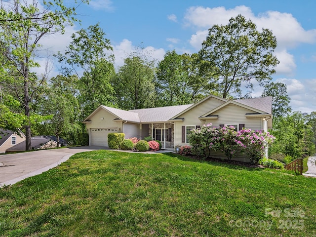 ranch-style house with an attached garage, a front lawn, and driveway