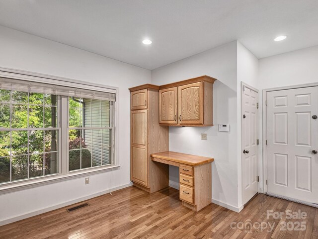 office area with baseboards, recessed lighting, light wood-style flooring, and visible vents