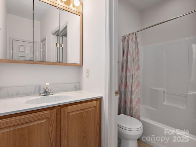 full bathroom featuring toilet, shower / bath combination with curtain, and vanity