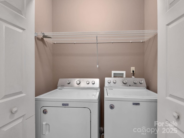 laundry room with laundry area and washer and clothes dryer