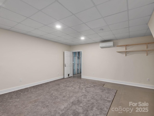 basement with baseboards, a wall mounted air conditioner, and recessed lighting