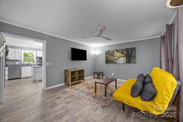 215 Calm Creek Rd, Fletcher, NC 28732 - living area with ornamental molding, a ceiling fan, baseboards, and light wood finished floors