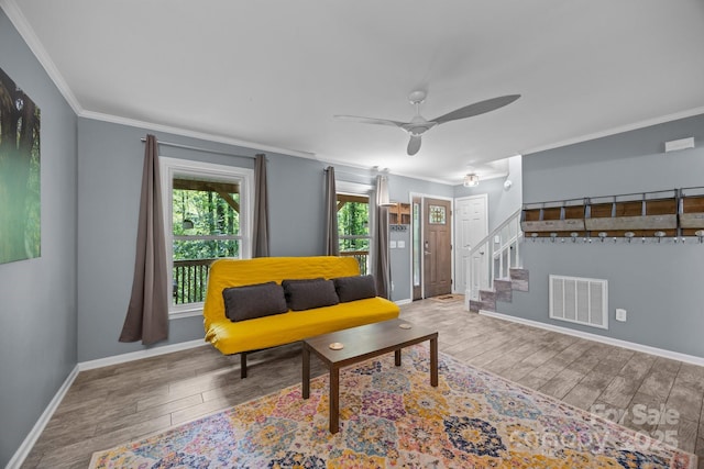 215 Calm Creek Rd, Fletcher, NC 28732 - living room with stairs, wood finished floors, baseboards, a ceiling fan, and crown molding