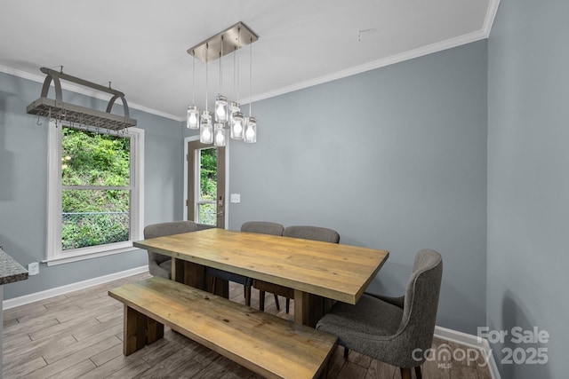 215 Calm Creek Rd, Fletcher, NC 28732 - dining space featuring baseboards, crown molding, wood finished floors, and a chandelier