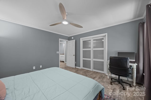 215 Calm Creek Rd, Fletcher, NC 28732 - bedroom featuring wood finished floors, crown molding, ceiling fan, baseboards, and a desk