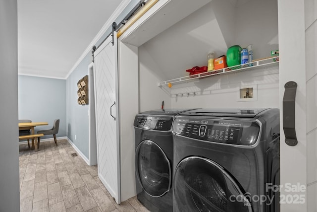 215 Calm Creek Rd, Fletcher, NC 28732 - laundry area with washer and dryer, a barn door, ornamental molding, and baseboards