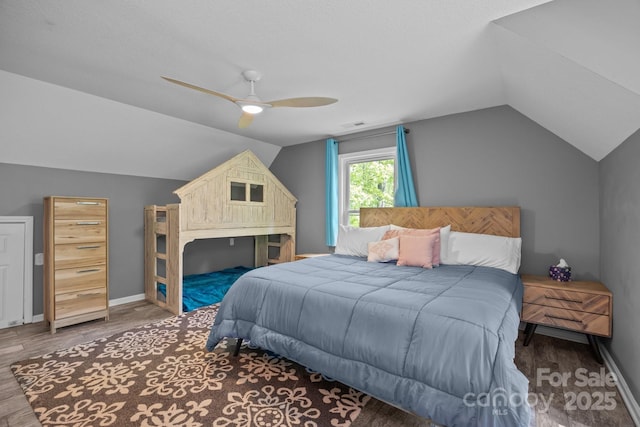 215 Calm Creek Rd, Fletcher, NC 28732 - bedroom with lofted ceiling, wood finished floors, a ceiling fan, and baseboards