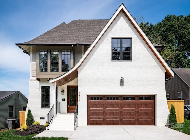 1817 Union St, Charlotte, NC 28205 - view of front of house with a garage, driveway, roof with shingles, and brick siding