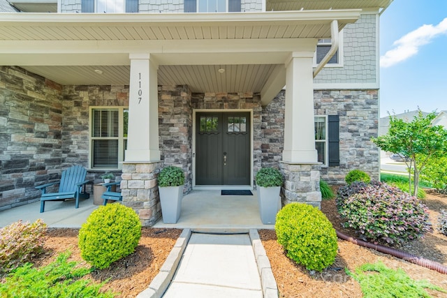 1107 Castle Rd, Indian Land, SC 29707 - property entrance featuring stone siding and covered porch