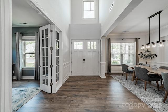 1107 Castle Rd, Indian Land, SC 29707 - foyer featuring plenty of natural light, dark wood-type flooring, ornamental molding, and french doors
