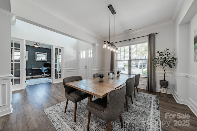 1107 Castle Rd, Indian Land, SC 29707 - dining area featuring french doors, crown molding, dark wood-style flooring, wainscoting, and a decorative wall