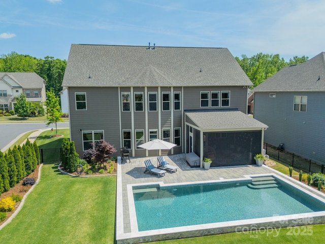 1107 Castle Rd, Indian Land, SC 29707 - rear view of property featuring a sunroom, a patio area, and a shingled roof