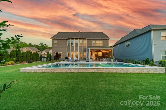 1107 Castle Rd, Indian Land, SC 29707 - back of property at dusk with a patio area