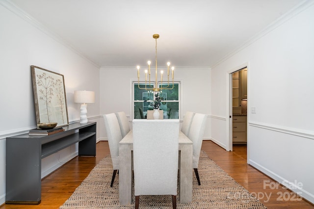 1209 Alfred St, Charlotte, NC 28211 - dining area with a chandelier, wood finished floors, and ornamental molding