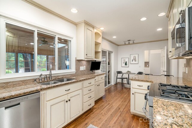 1209 Alfred St, Charlotte, NC 28211 - kitchen with stainless steel appliances, a sink, decorative backsplash, recessed lighting, and open shelves