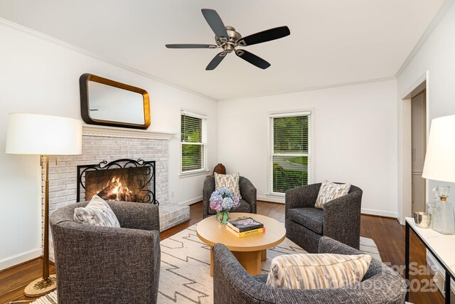 1209 Alfred St, Charlotte, NC 28211 - living area with a fireplace, crown molding, wood finished floors, a ceiling fan, and baseboards