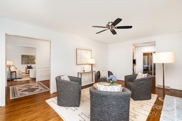 1209 Alfred St, Charlotte, NC 28211 - living area with wood finished floors, a ceiling fan, and crown molding