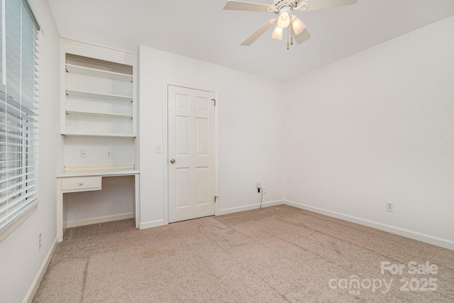 1209 Alfred St, Charlotte, NC 28211 - unfurnished bedroom featuring light colored carpet, baseboards, and a ceiling fan