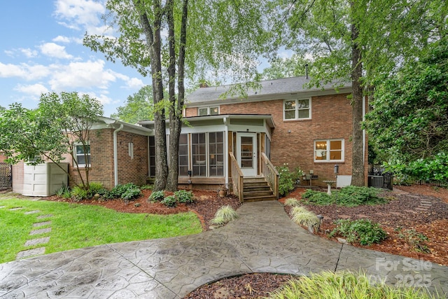 1209 Alfred St, Charlotte, NC 28211 - back of house featuring a sunroom and brick siding