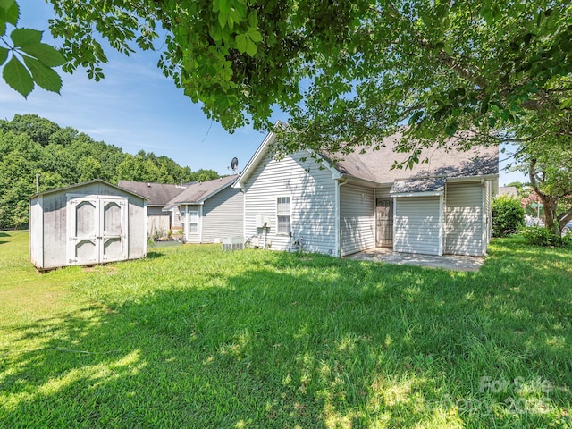 6212 Derryfield Dr, Charlotte, NC 28213 - rear view of property featuring a shed and a yard