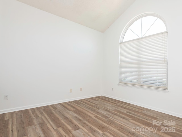 6212 Derryfield Dr, Charlotte, NC 28213 - empty room with vaulted ceiling and wood finished floors