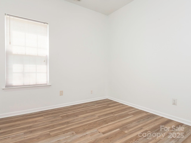 6212 Derryfield Dr, Charlotte, NC 28213 - unfurnished room with baseboards and light wood-type flooring