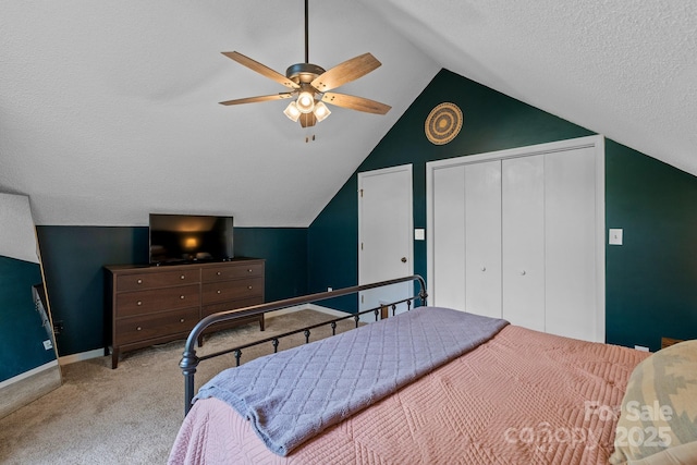 14 Leisure Ln, Weaverville, NC 28787 - bedroom with vaulted ceiling, carpet flooring, a closet, a textured ceiling, and ceiling fan