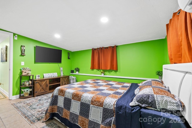 tiled bedroom featuring recessed lighting and baseboards
