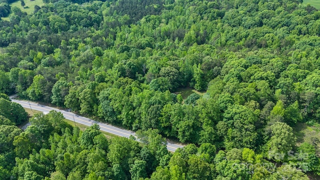 aerial view of property's location with a forest