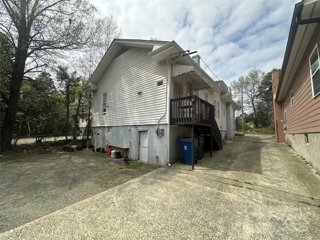 2511 Chapel Hill Rd, Durham, NC 27707 - view of home's exterior featuring concrete driveway and a chimney
