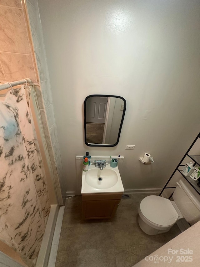 2511 Chapel Hill Rd, Durham, NC 27707 - full bathroom with baseboards, a stall shower, toilet, and vanity