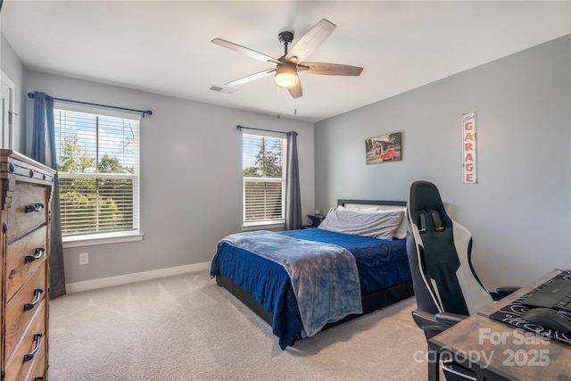 bedroom with a ceiling fan, baseboards, light colored carpet, and visible vents