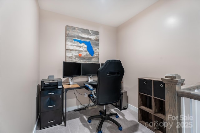 home office with carpet floors and baseboards