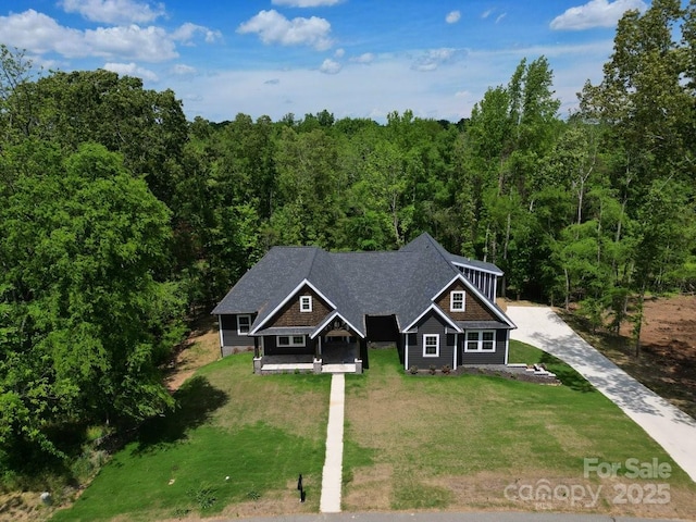 2694 Woodcrest Dr SW, Concord, NC 28027 - view of front of home with a view of trees, a front yard, and concrete driveway