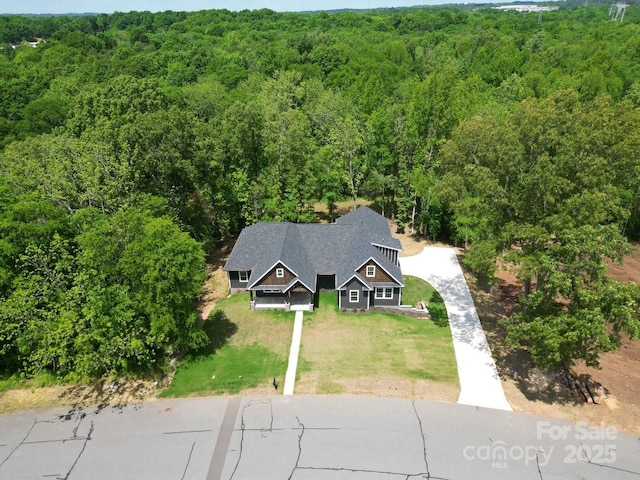 2694 Woodcrest Dr SW, Concord, NC 28027 - aerial view with a wooded view