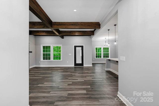 2694 Woodcrest Dr SW, Concord, NC 28027 - unfurnished living room featuring baseboards, dark wood-style flooring, and beam ceiling