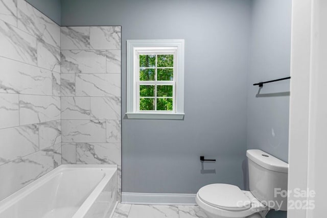 2694 Woodcrest Dr SW, Concord, NC 28027 - bathroom featuring baseboards, marble finish floor, toilet, and shower / washtub combination