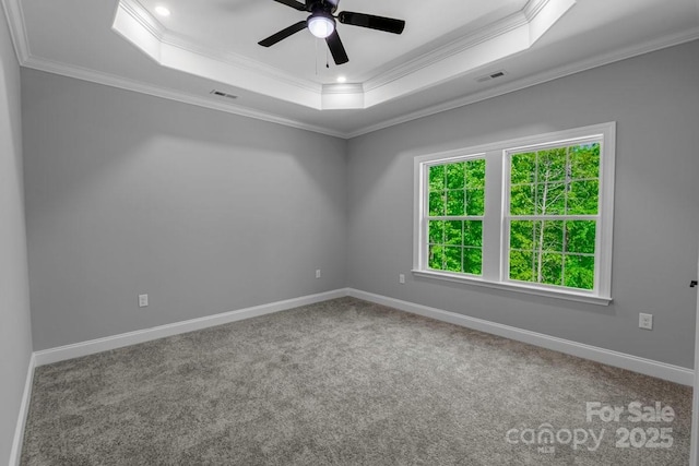 2694 Woodcrest Dr SW, Concord, NC 28027 - carpeted empty room featuring crown molding, a raised ceiling, a ceiling fan, and visible vents