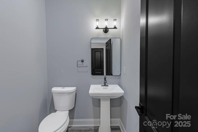 2694 Woodcrest Dr SW, Concord, NC 28027 - bathroom with baseboards and toilet