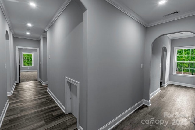 2694 Woodcrest Dr SW, Concord, NC 28027 - hall with baseboards, arched walkways, dark wood-style floors, and ornamental molding