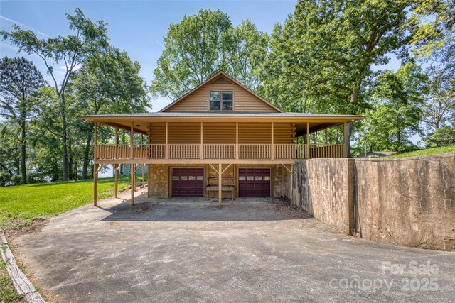993 Jackson Rd, Fort Lawn, SC 29714 - exterior space with aphalt driveway, a garage, and log exterior