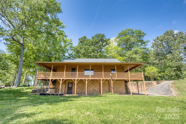 993 Jackson Rd, Fort Lawn, SC 29714 - back of property with log siding, a deck, and a lawn