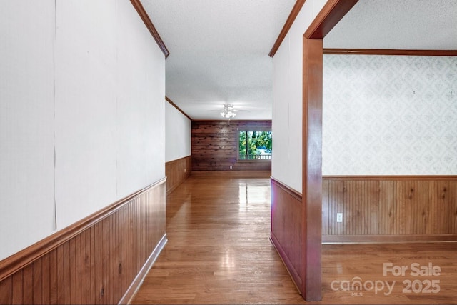 993 Jackson Rd, Fort Lawn, SC 29714 - hallway with light wood finished floors, wood walls, crown molding, and a wainscoted wall
