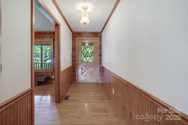 993 Jackson Rd, Fort Lawn, SC 29714 - doorway to outside with wainscoting, wood walls, and visible vents
