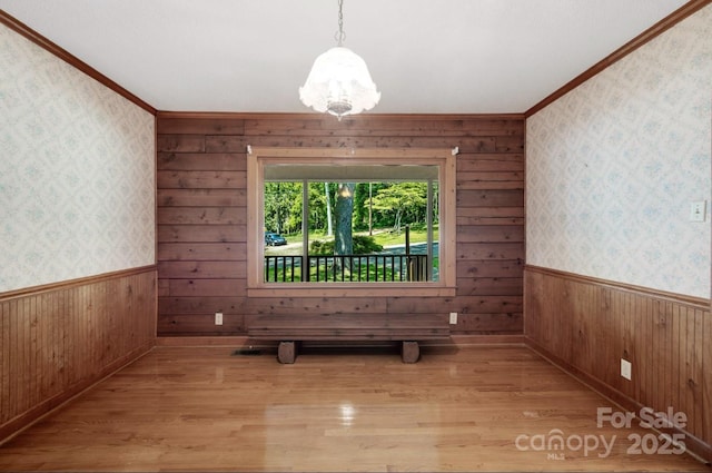 993 Jackson Rd, Fort Lawn, SC 29714 - empty room with light wood-type flooring, wood walls, and wainscoting